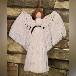 Handcrafted Macrame Guardian Angel in Elegant Beige: A Delicate Home Decoration